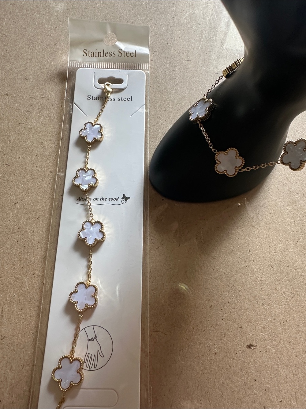 Gold Stainless Steel Bracelet with White Clover Charms